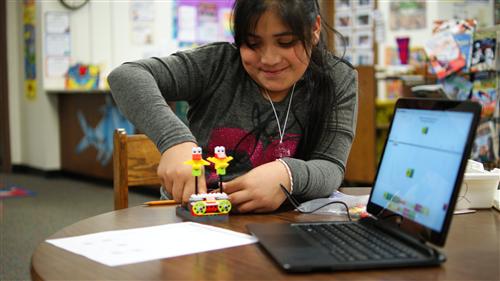 Student building a robot 