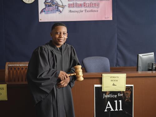 male student in judge's robe 
